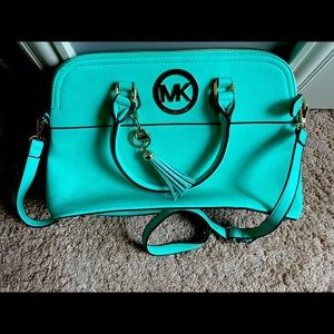 Michael Kors factory teal purse w gold accents